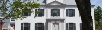 white brick building on u n e's portland campus